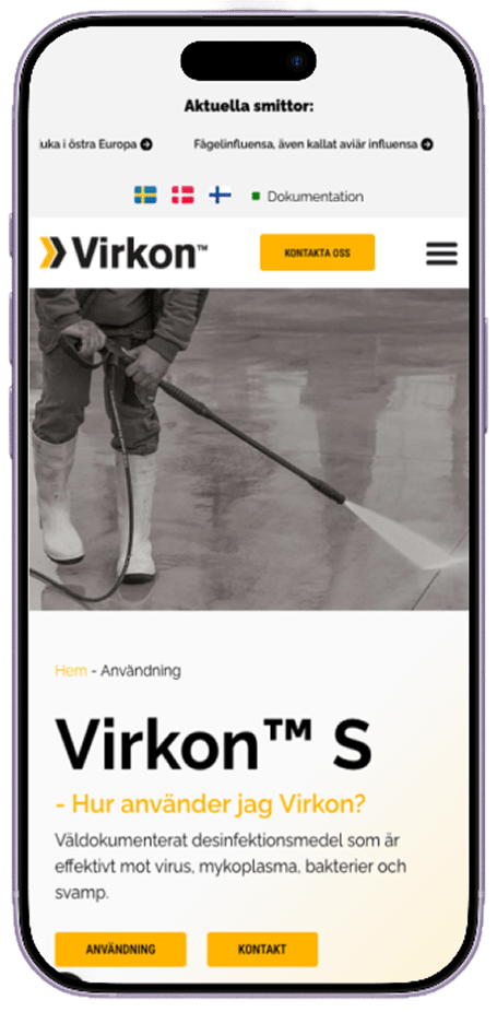 En mobiltelefon med virkons webbsida på skärmen